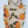 Citrus gathering tote bag on a white background