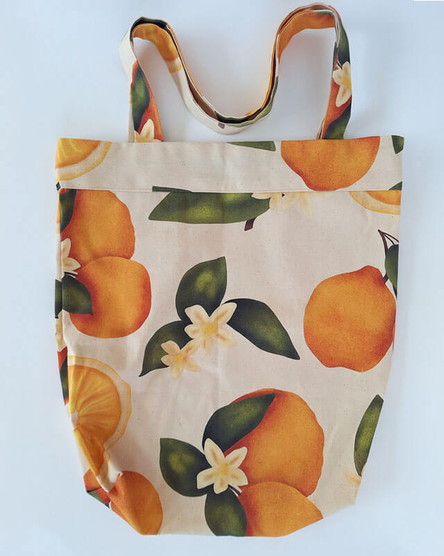 Citrus gathering tote bag on a white background